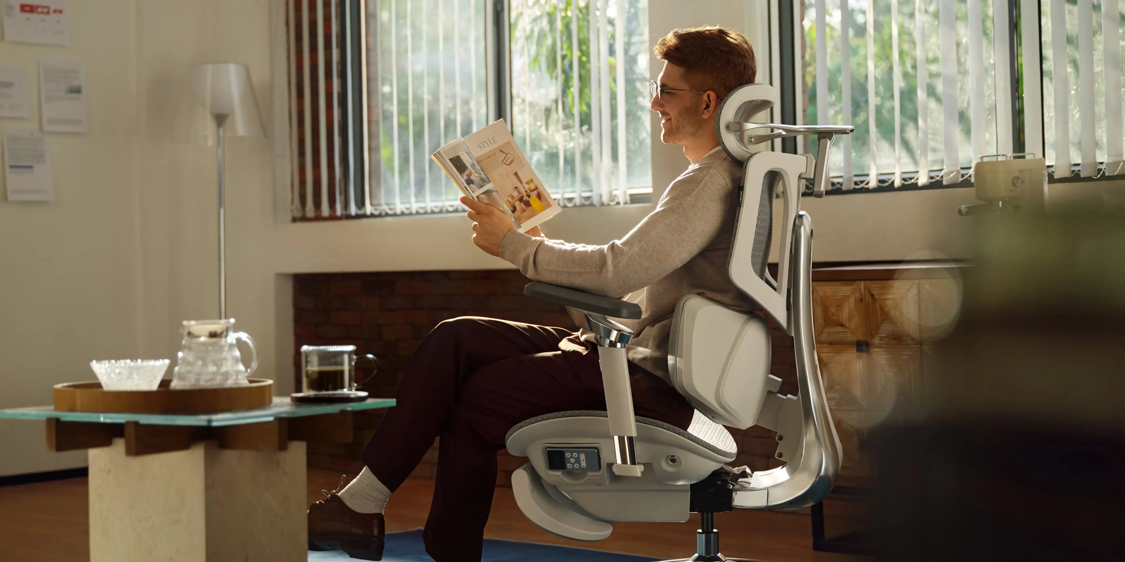 Shared Workspace: Modern coworking space equipped with adjustable Ergo Select chairs for various users.