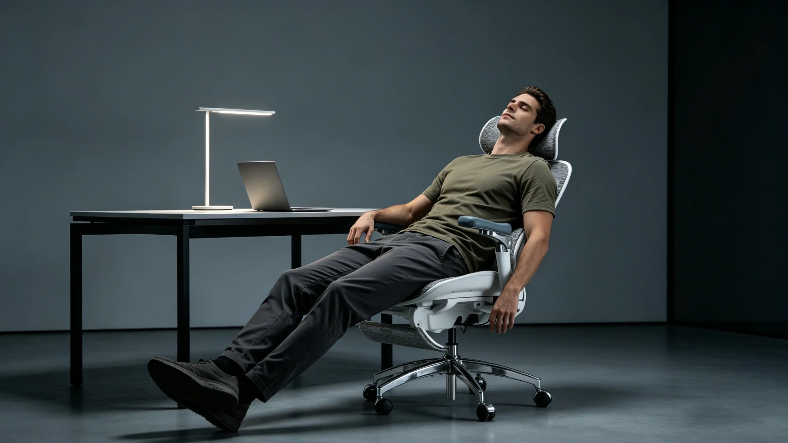 Full body view of a 36-year-old Caucasian male founder in an olive tee sitting in the [office chair most comfortable].