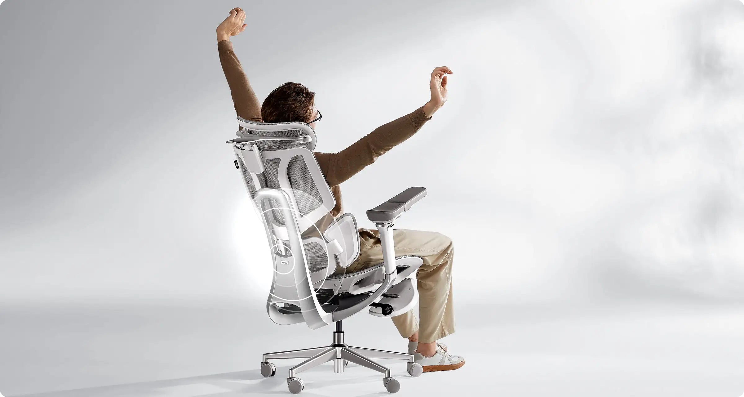 Wide and supportive headrest on an ergonomic office chair for extra sleeping comfort.