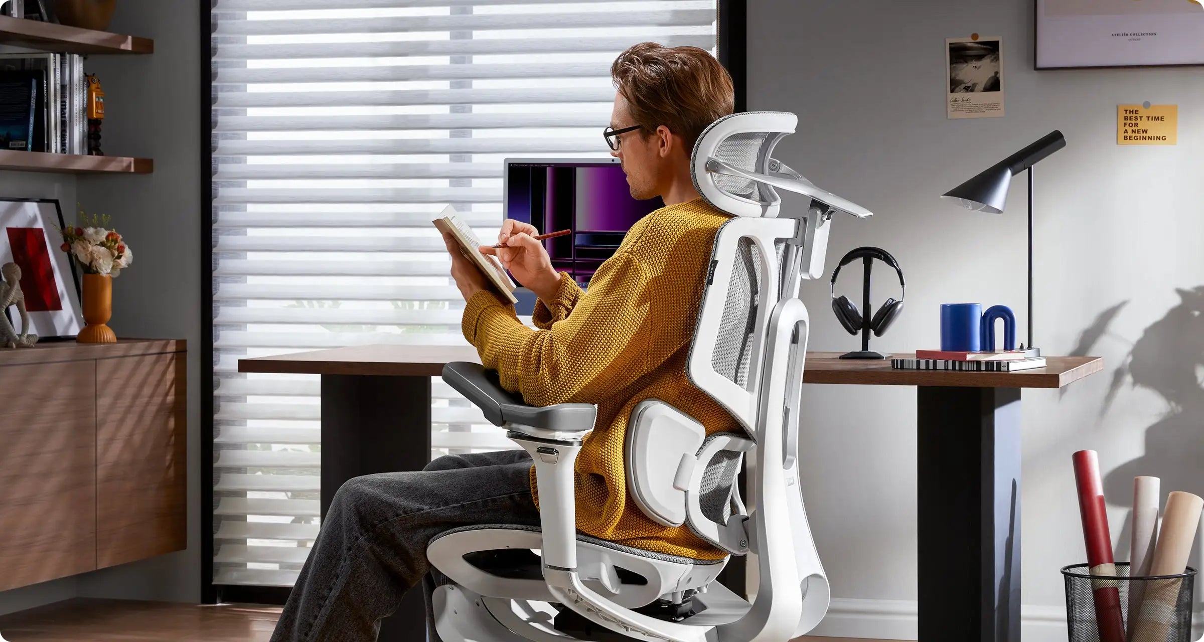 Double-jointed headrest adjustment view on a white mesh ergonomic office chair.