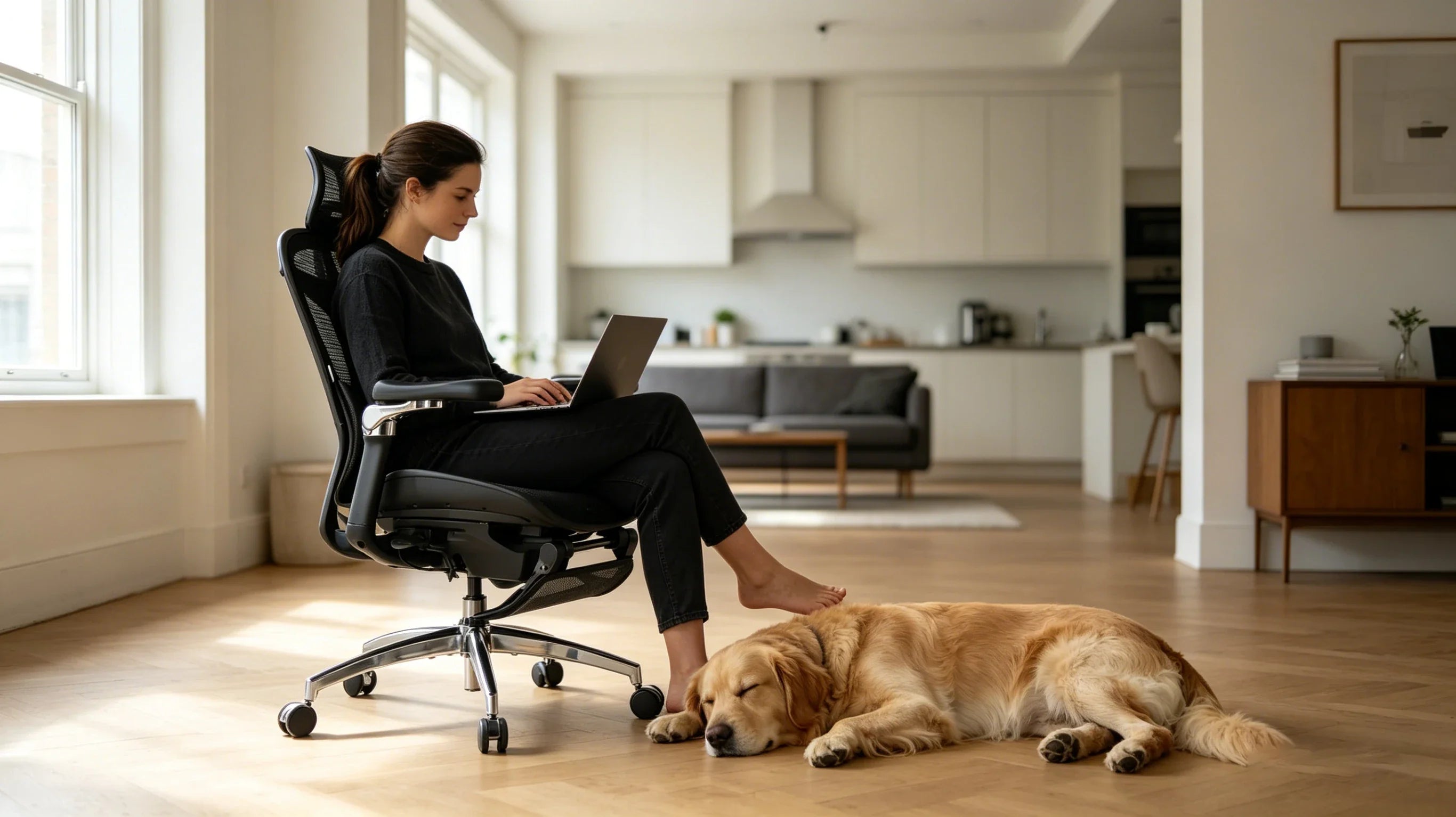 Full view of a 32-year-old female developer sitting in the [best officechair] at her dual-monitor workstation.