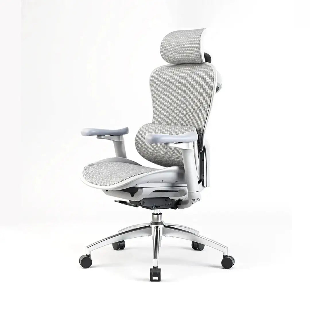 Black mesh desk chair in a creative designer's studio, highlighting professional aesthetics and comfort.