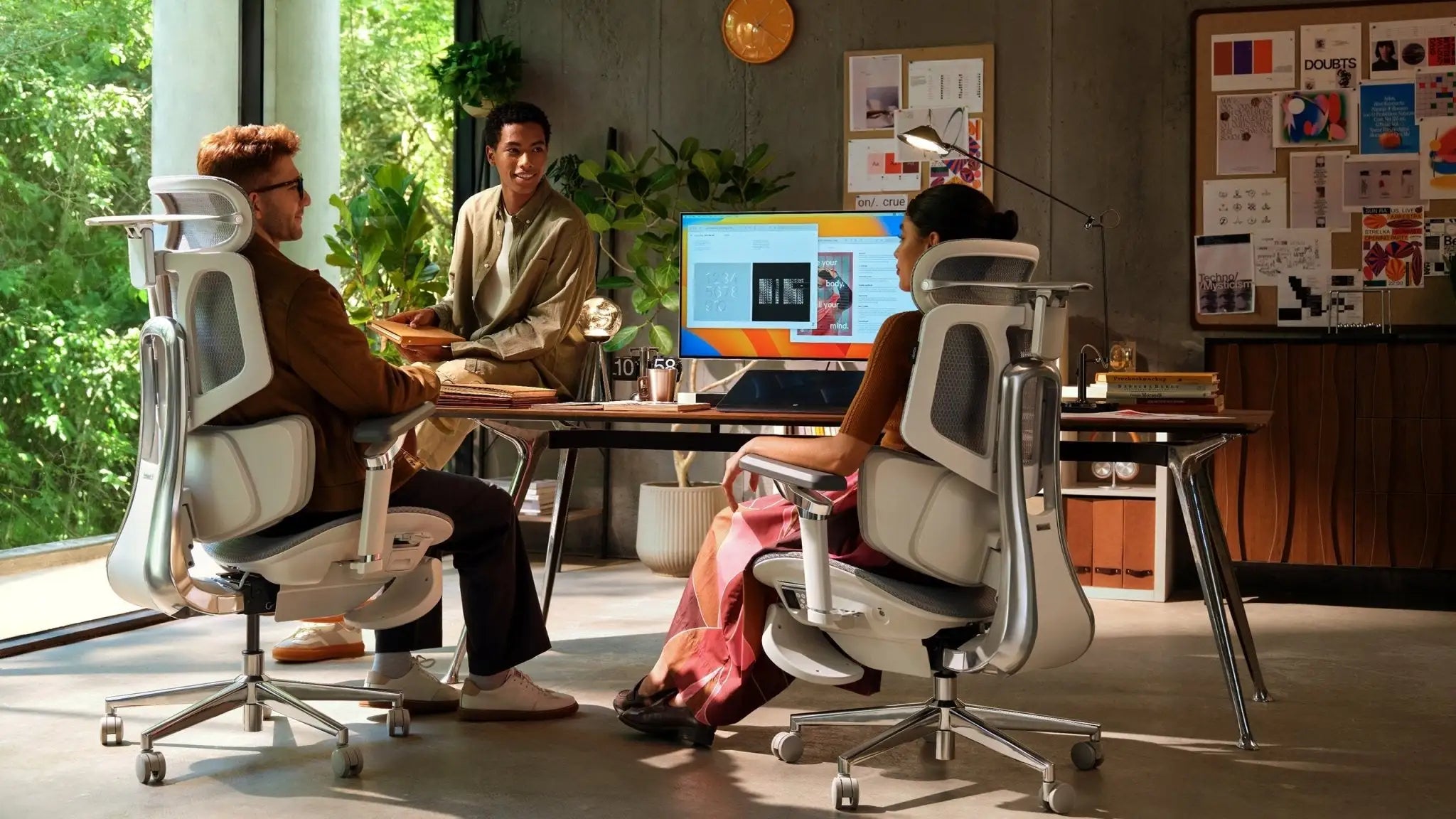 Focus Mode: Product designer focusing on deep work in an Ergo Select chair with optimal spinal alignment.