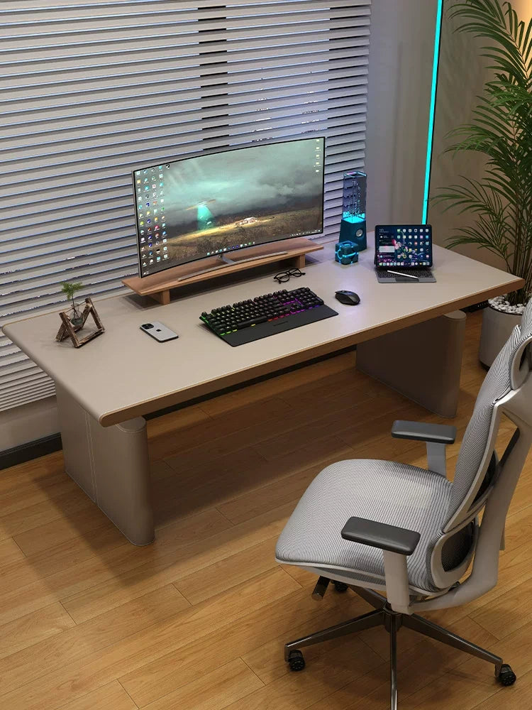 Light camel saddle leather electric standing desk in a modern executive office