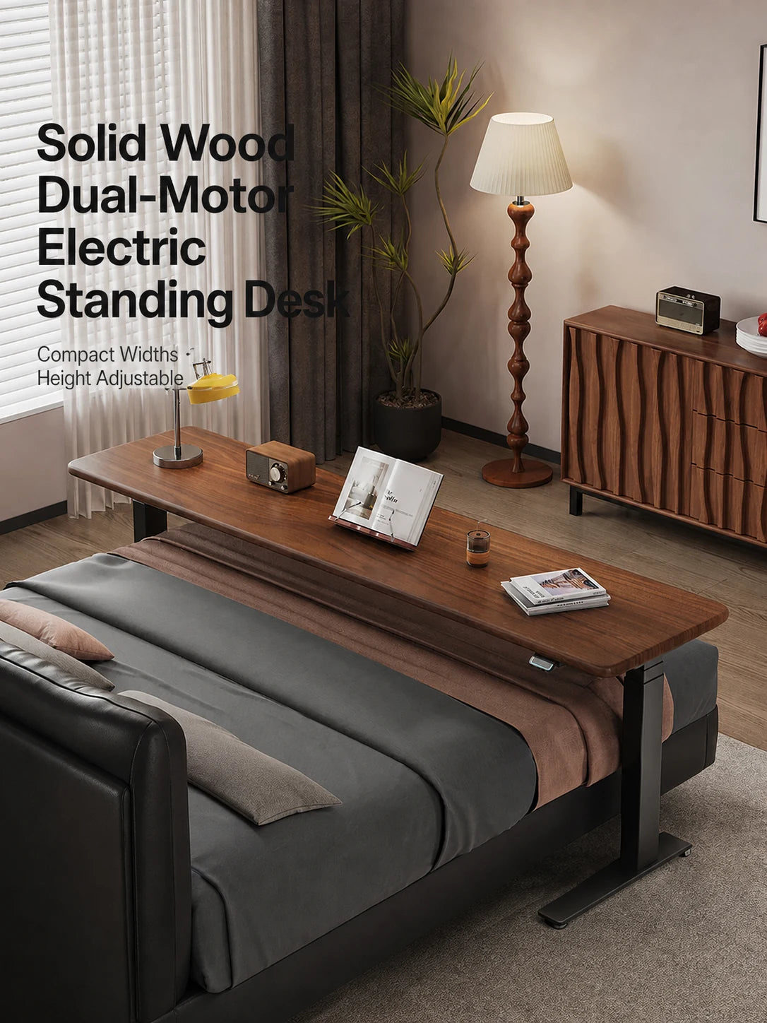 compact solid wood dual-motor electric standing desk beside a bed