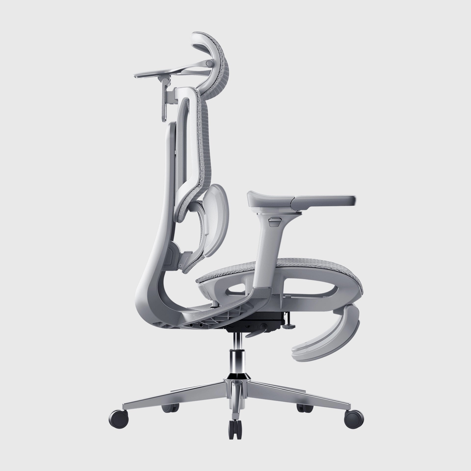 A creative designer working on a tablet in a modern studio with an ergonomic office chair.