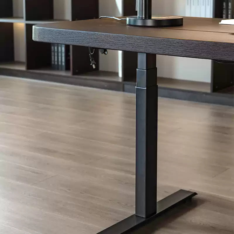 Close-up of the telescoping metal leg on the dual-motor standing desk