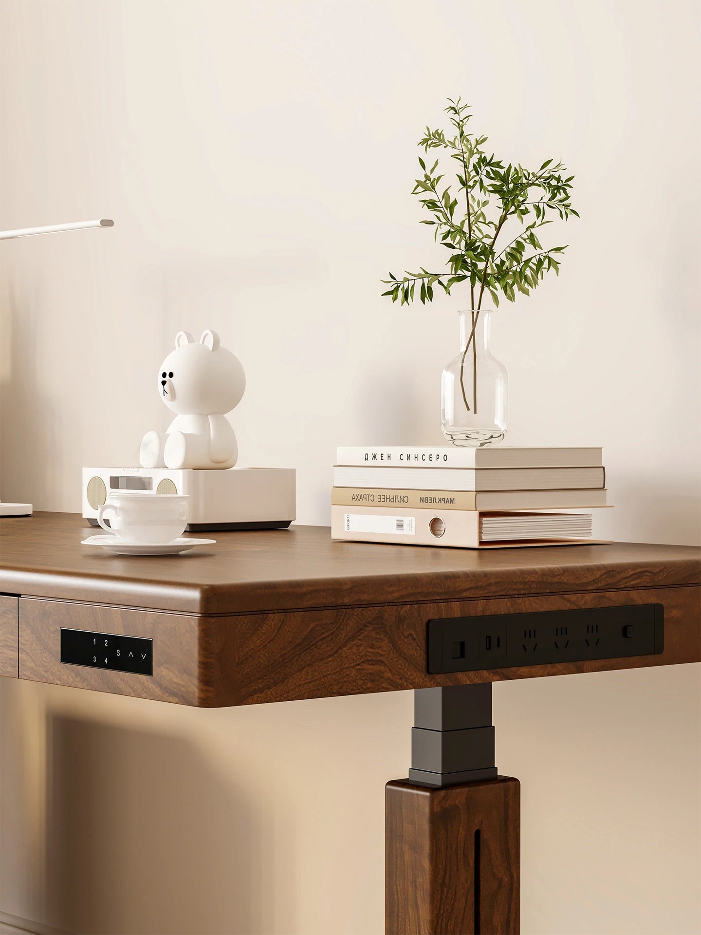 Electric standing desk showing the control panel and built-in power access