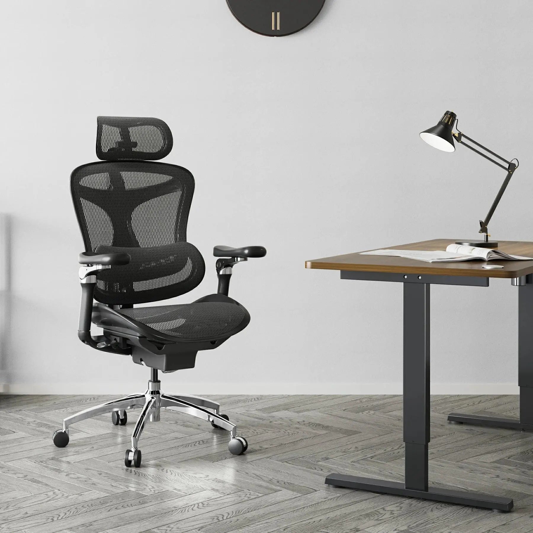 Ergonomic computer chair in black mesh with a supportive headrest for neck pain prevention.