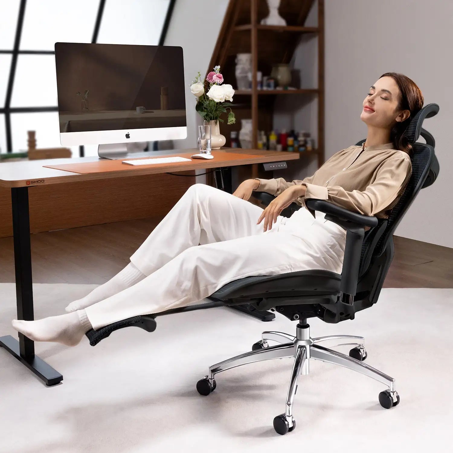 Black mesh ergonomic desk chair providing superior back support for professional workstations.
