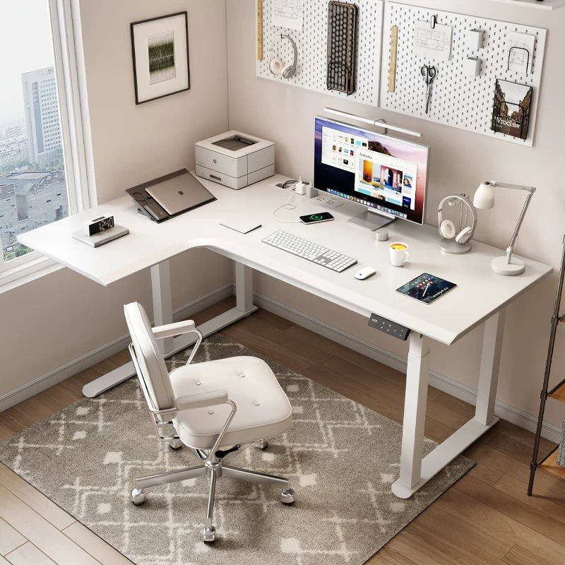 Modern white L-shaped electric standing desk in a home office