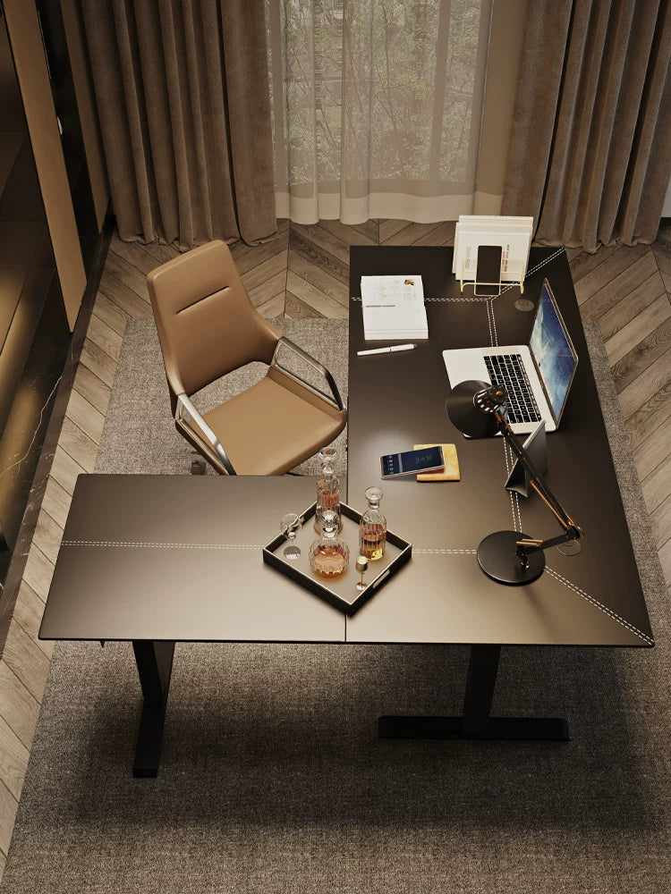 Large black L-shaped electric standing desk for an executive workspace