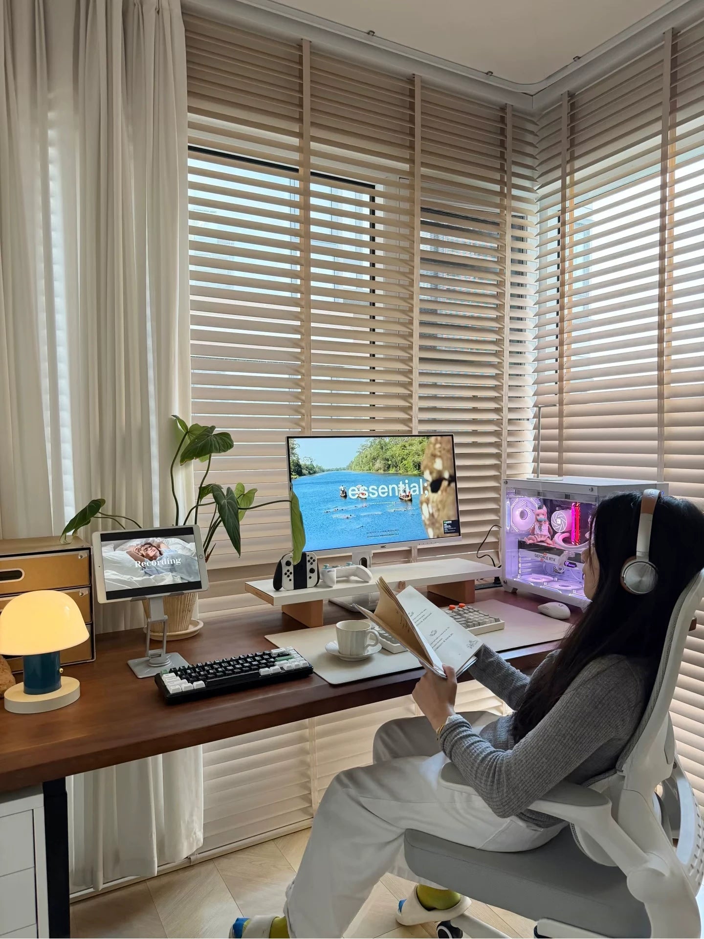 Solid wood electric standing desk configured as a gaming workstation