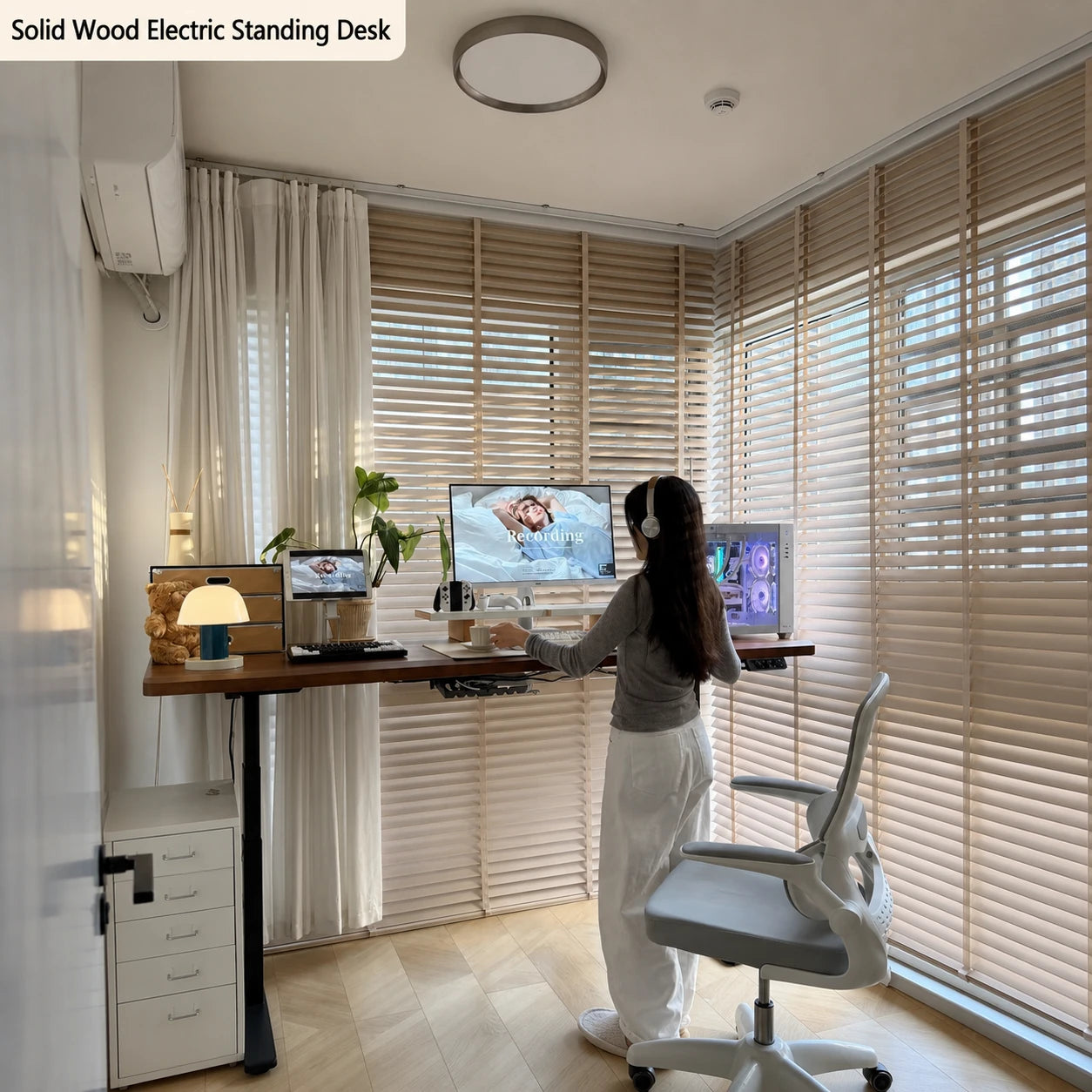 Solid wood electric standing desk in a bright home office