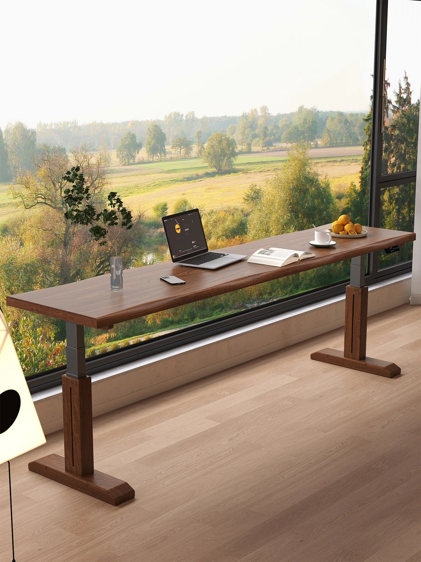 Solid wood electric standing desk beside a floor-to-ceiling window
