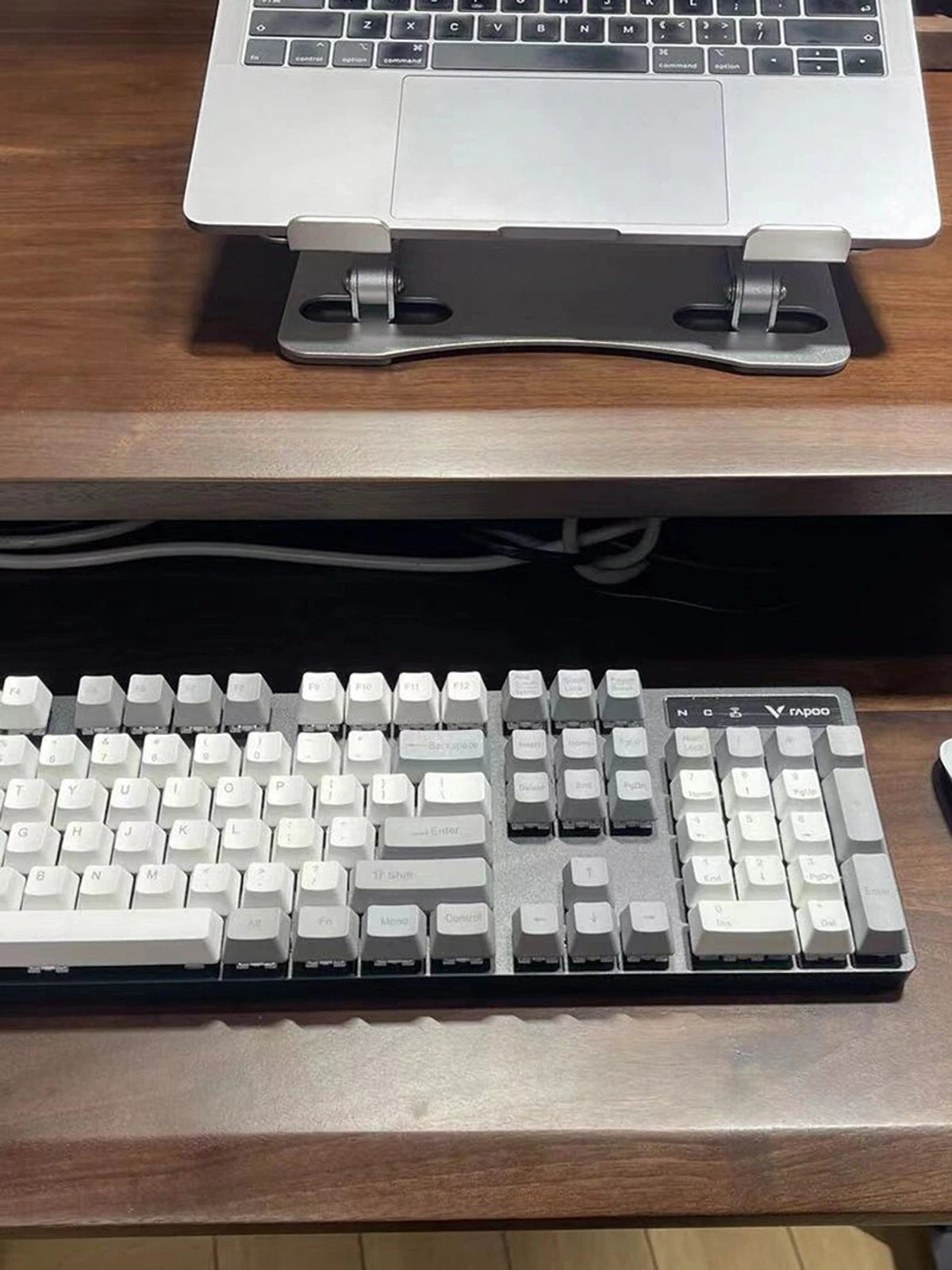 Large keyboard tray on a solid wood height-adjustable desk
