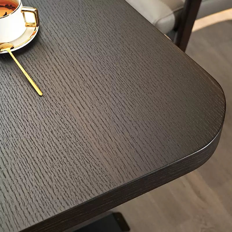 Close-up of the rounded wood desktop edge on the electric standing desk