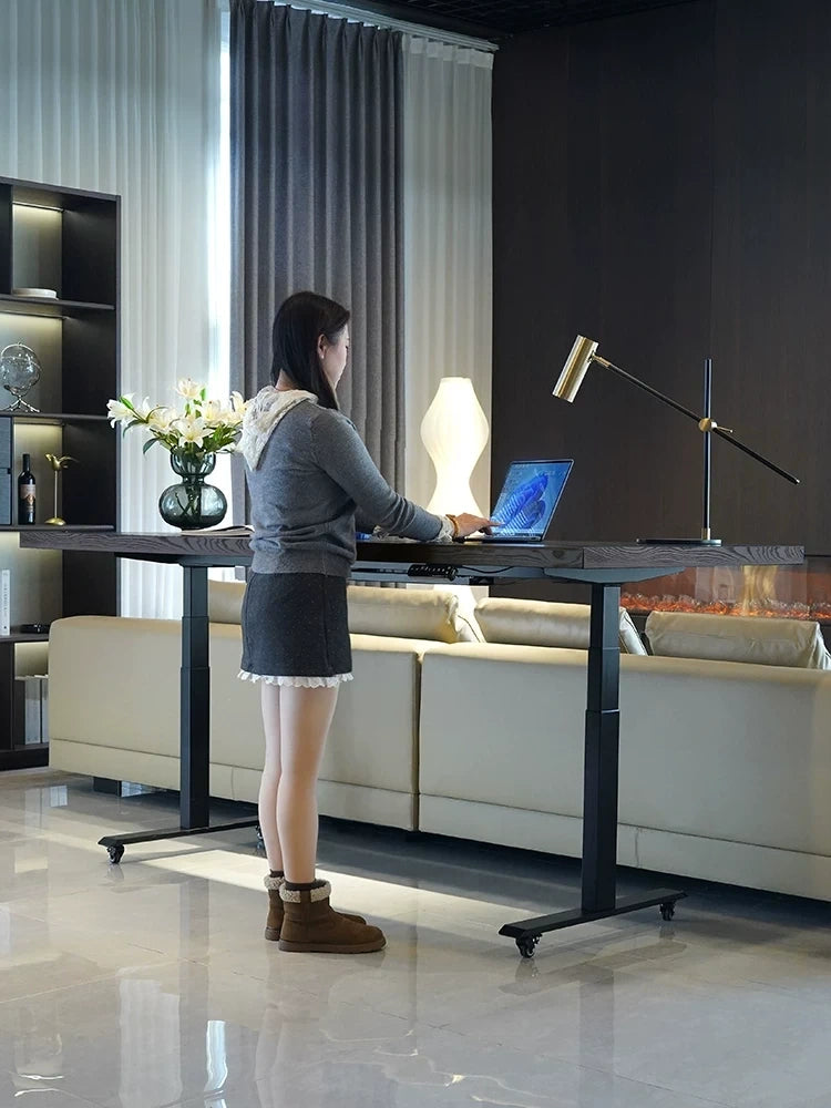 White ash electric standing desk used as a sit stand workstation