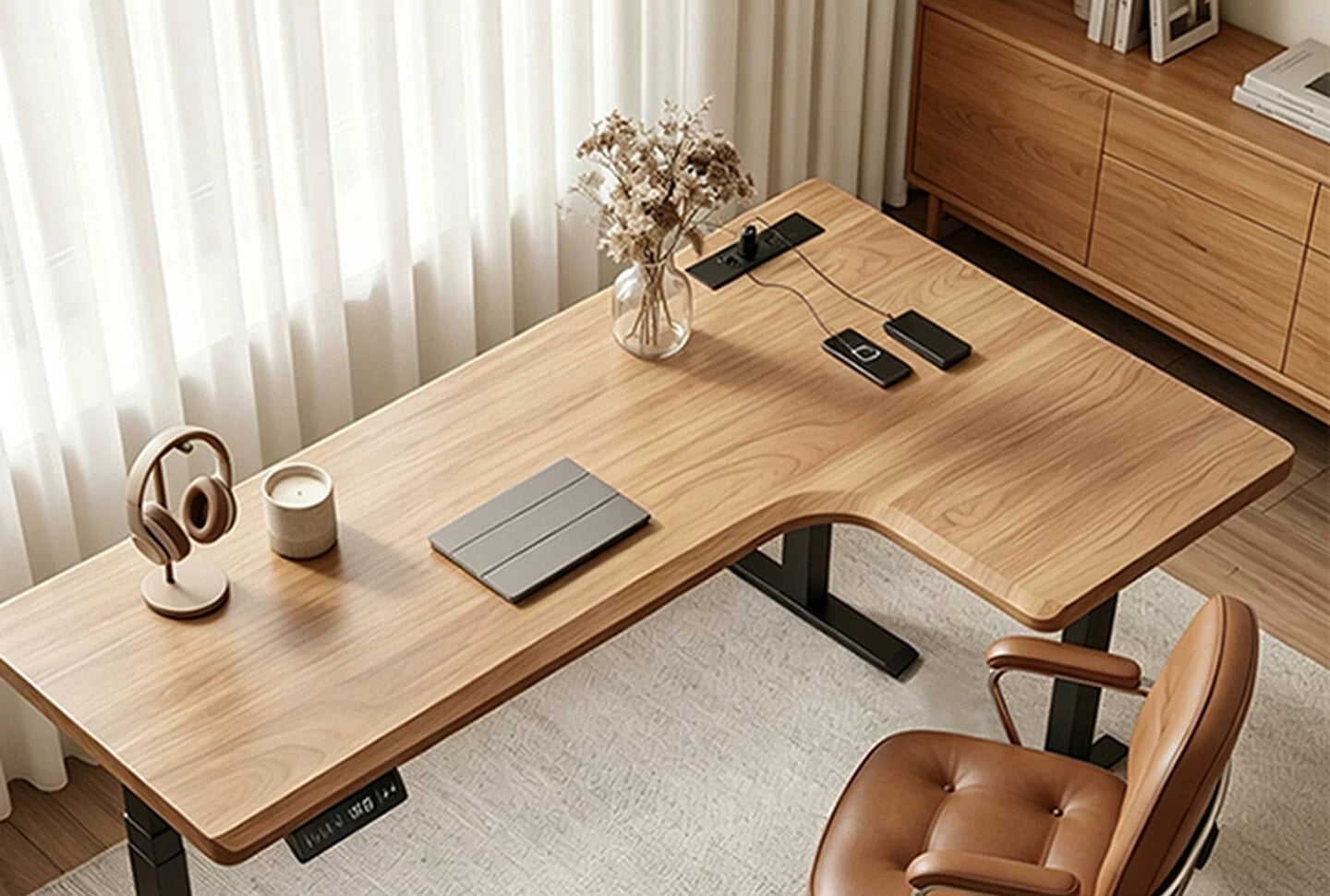 White ash L-shaped electric standing desk with triple-motor lift in a bright home office